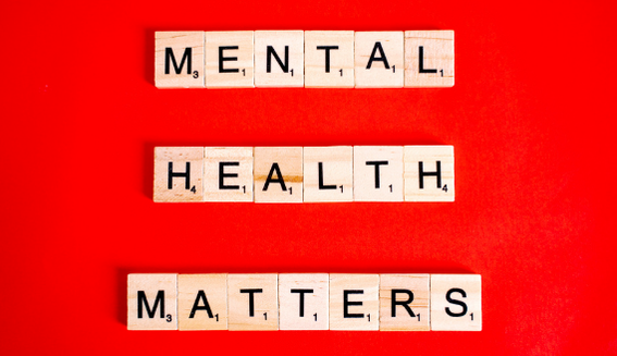 Scrabble times spelling mental health matters on red background